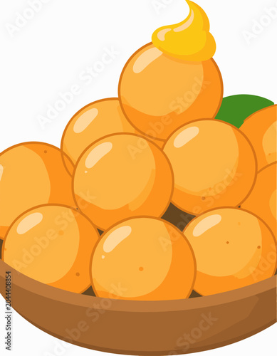 A pile of orange treats topped with bright yellow frosting