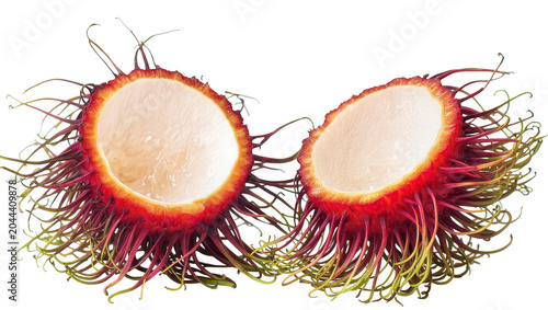 Schilderij op canvas Two halves of a ripe rambutan fruit showing white flesh and red spiky skin