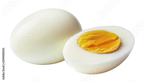 Fényképezés Whole and halved hard-boiled egg with bright yellow yolk