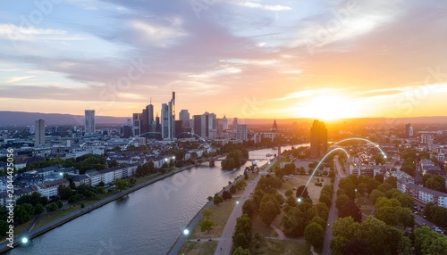 City skyline with sunset, connected data lines