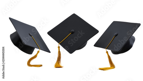 Three black graduation caps with gold tassels