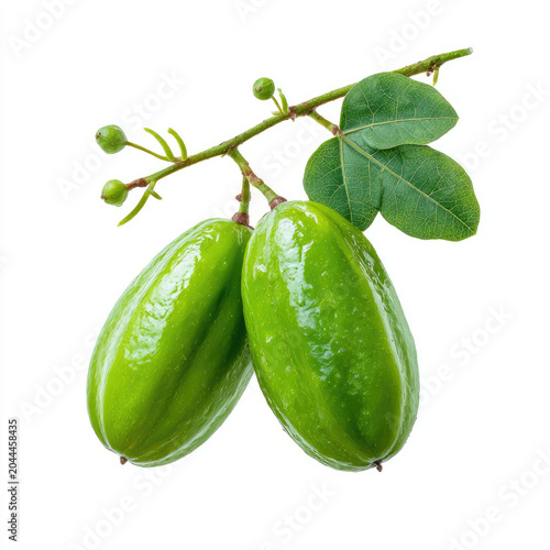 Green bilimbi fruit with leaves on white background