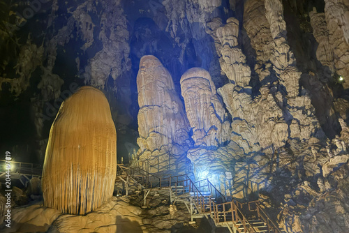 Photography Stunning limestone cave interior with illuminated stalactites and stalagmites