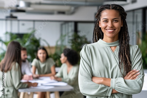 Confident Black female manager leading inclusive startup team in modern office. Professional woman entrepreneur supporting workplace diversity, collaboration planning and corporate leadership culture