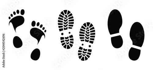 Schilderij op canvas Footprint Variations: A collection of three distinct black footprint impressions