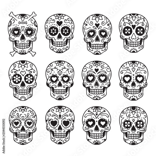 Day of the Dead sugar skulls with intricate floral patterns and heart designs on white background