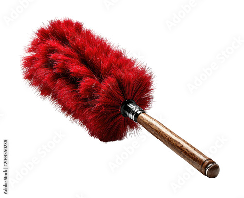 Red fluffy duster with wooden handle on black backdrop, angled