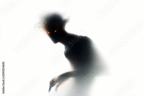 Minimal dark demon silhouette with glowing ember eyes for horror poster and background design featuring a hunched smoke creature and eerie posture