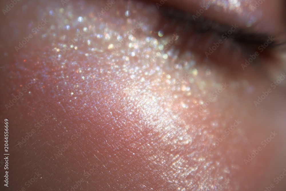 Fototapeta premium Macro opalescent skin shimmer closeup texture with iridescent glow for beauty background and makeup detail