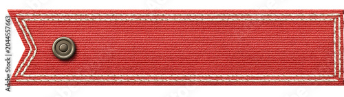 Red fabric badge with trimmed edges and centered metal button