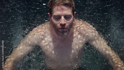 Cold recovery defines the moment as a man submerges in an outdoor ice bath