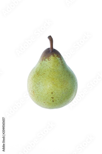 A green pear with brown irregular dots and spots, the stalk with brownish patch, side view slightly from up, on white background