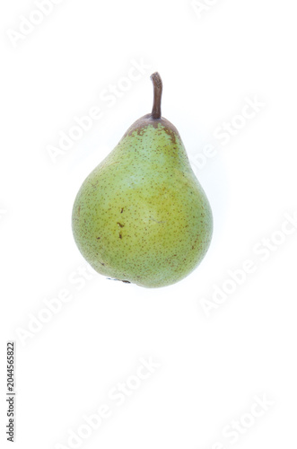 A green pear with brown irregular dots and spots, the stalk with brownish patch, side view, on white background
