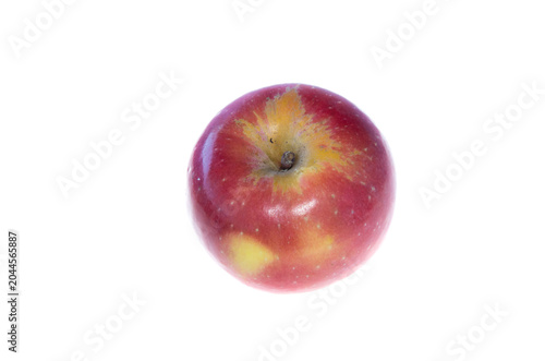 A red apple with greenish center from the upper side on white background
