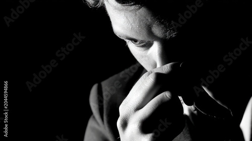 Man in deep thought black and white portrait silhouette and focus
