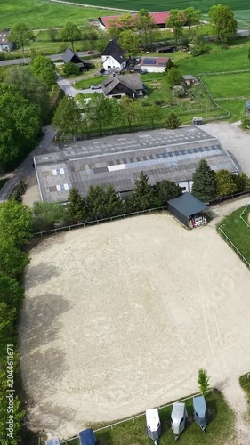 Aerial view of an equestrian center with a horse arena
