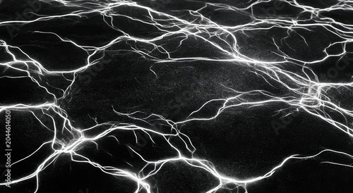 Abstract luminous network of cracks on a dark, textured surface