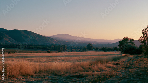 Nostalgic Film Photography Aesthetic 35mm Grain Sunset Over Dry Grassland
