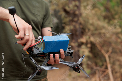 military drone in the hands of a military man