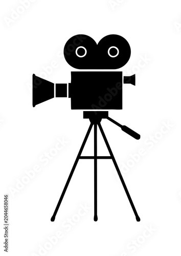 Vintage movie camera on tripod, classic cinema production icon