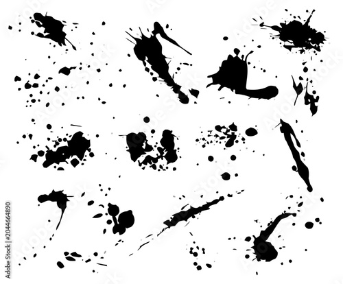 Black Ink Splatters Over White Background