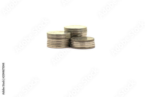 Coins stacked on a white background.