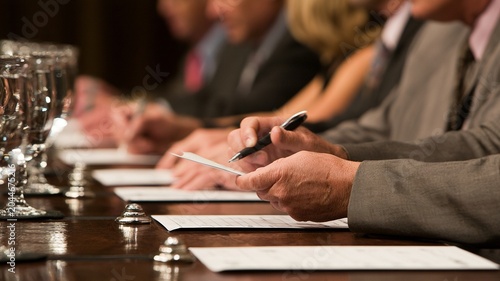 During the competitive panel review, the judge carefully flips the scorecard.