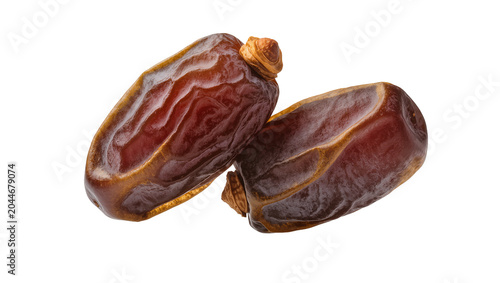 фотографія Two ripe Medjool dates with wrinkled skin and stems