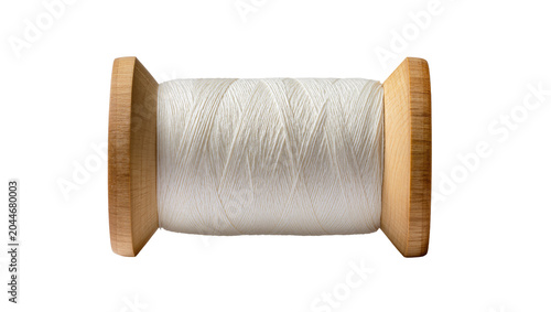 Foto Wooden spool with white thread wound tightly