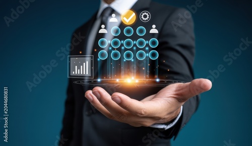 Businessman holding a holographic display showing organizational chart and analytics data with glowing effects.