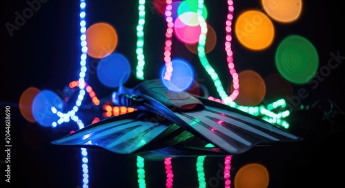 Underwater Fins Illuminated by Colorful Bokeh Lights in Dark Environment.