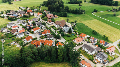 Aerial drone view of German farm buildings with solar panels on roof