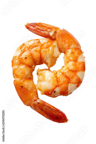 Single cooked shrimp with tail on, peeled and seasoned, isolated on a light background.