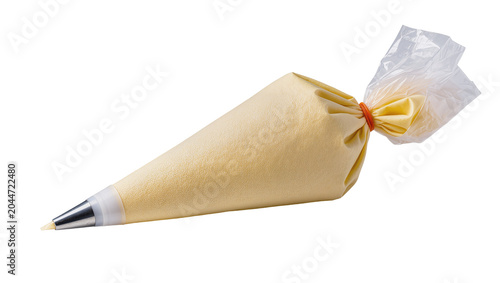 Pastry bag filled with yellow cream and metal tip