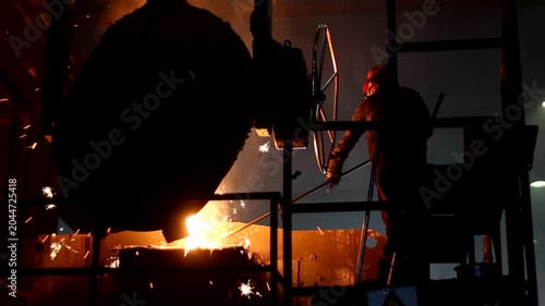 Steelworker Operating Molten Metal in Industrial Foundry