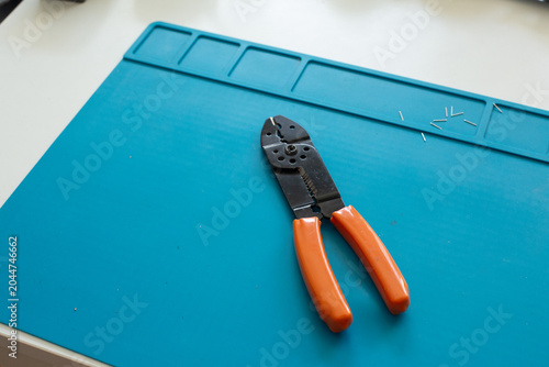 Wire crimping tool on silicone soldering mat