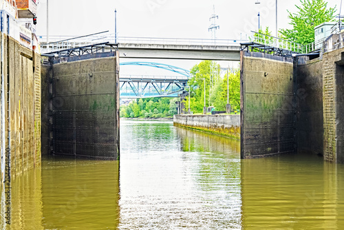 Lock gates on the River Danube near Passau in Germany begin to open so that a ship can pass through.