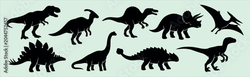 Fotografija Set of dinosaur black silhouettes featuring predatory and herbivorous prehistori