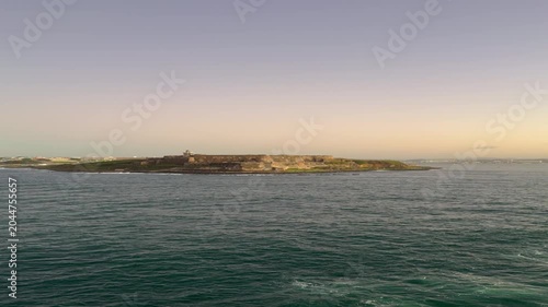 A view of Puerto Rico from the ocean while cruising during the evening sunset.