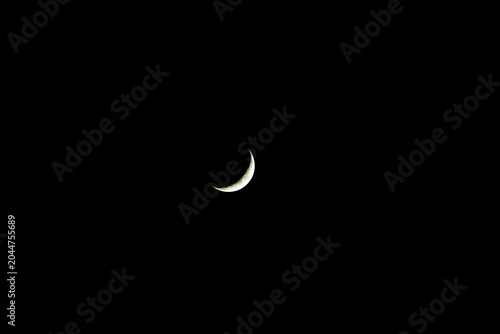 Crescent moon, star beside the moon