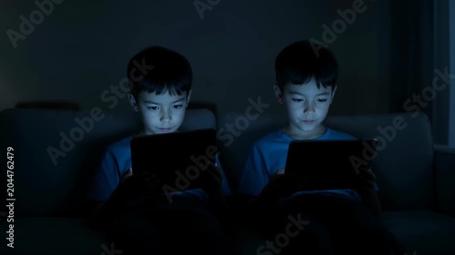 Two Boys on Tablets in Dark Room at Night iPad Kids Screen Addiction Technology Danger Stock Footage