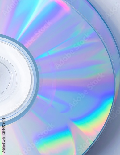 A close-up abstract of a disc's iridescent surface reflecting rainbow colors