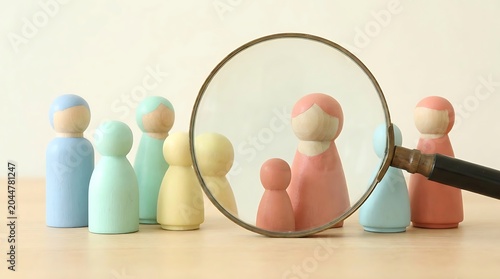 Magnifying Glass Focuses on Family Figures Representing Targeted Audience.