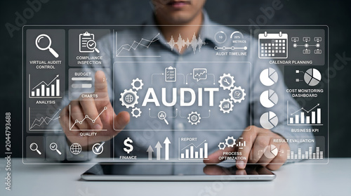 Businessman interacting with a futuristic digital interface for comprehensive audit, financial analysis, and strategic data management