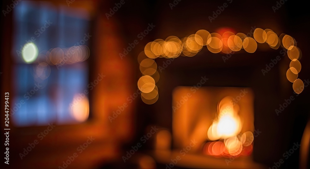 Fototapeta premium Cozy blurred fireplace with warm lights and window view.