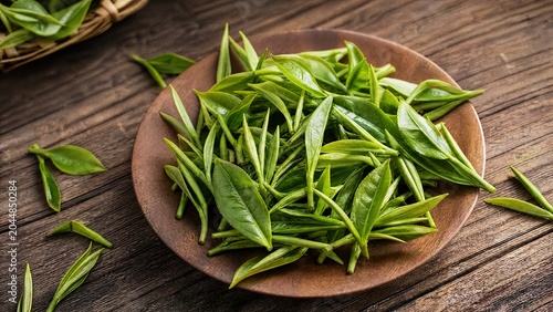 Fresh Tea Leaves on Rustic Wooden Surface Overhead View