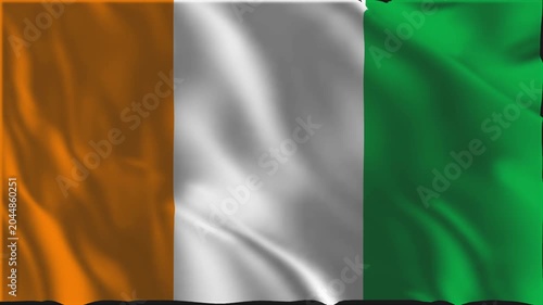 The flag of Ivory Coast waving slowly in the foreground.