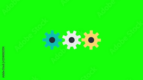 Three colorful gears rotating in sync on a green screen background