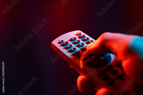 Quadro em tela Hold remote control in hand 3