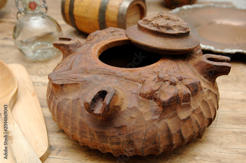 Grolla valdostana is a typical wooden container from Valle d’ Aosta Italy used for drinking Valdostana coffee that is a coffee blended with grappa and genepì